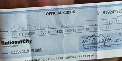 Counterfeit cheque used in phtographer scam